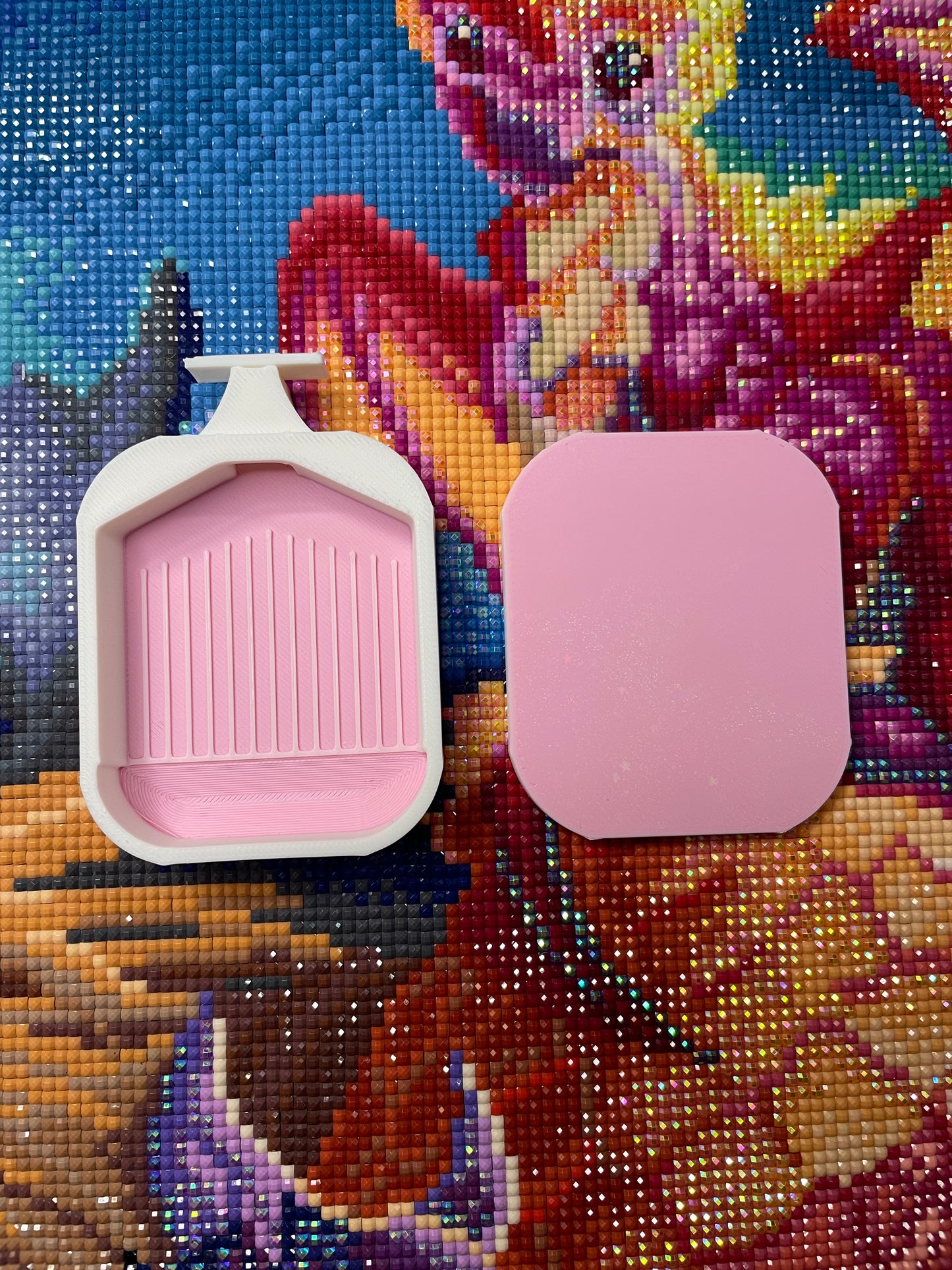 Mini Deluxe 2 Phoenix Diamond Painting Tray in pink on colorful background, shown with lid off and no washi area.