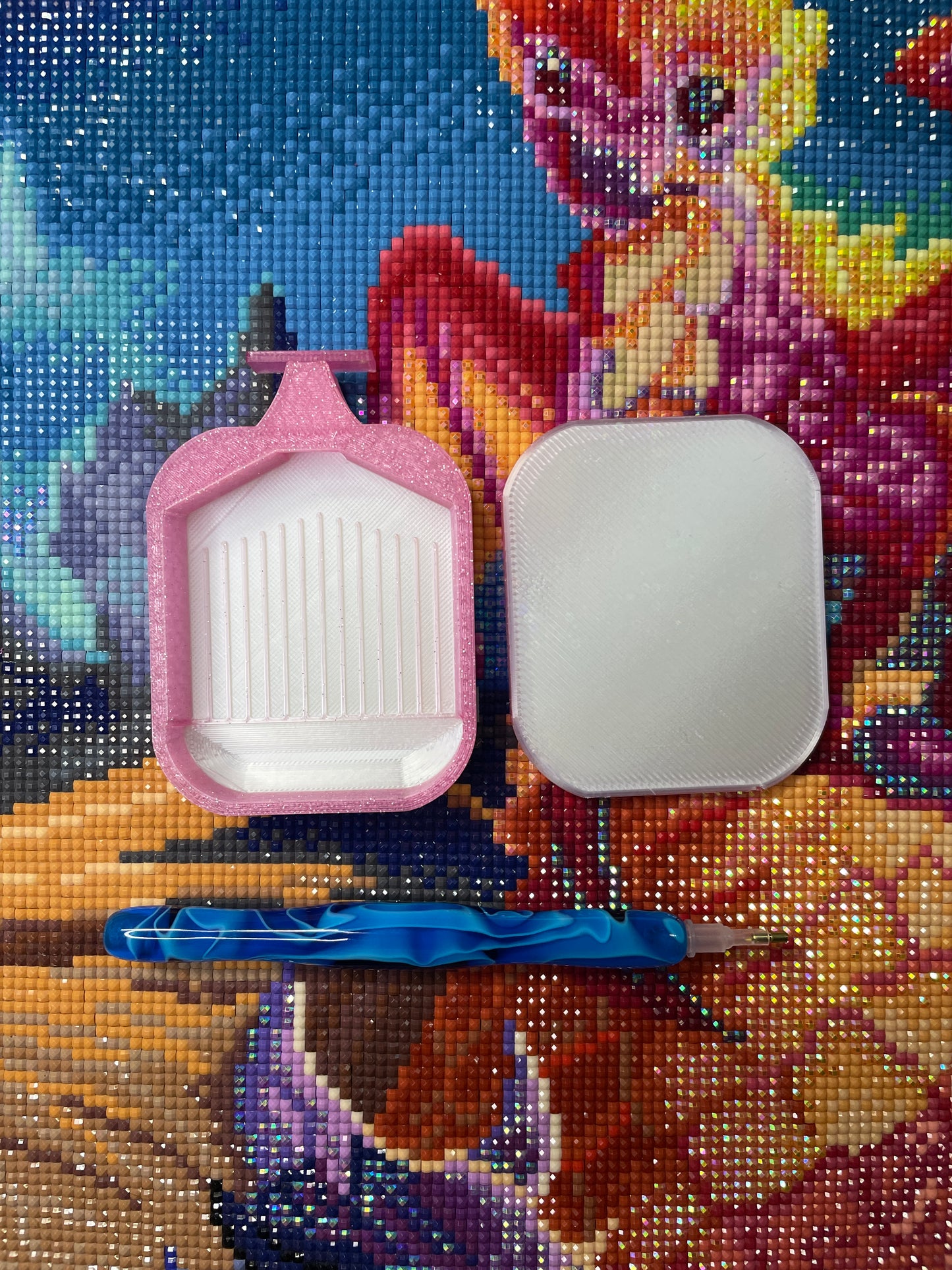 Pink Deluxe 2 Phoenix small diamond painting tray with blue tool on colorful background