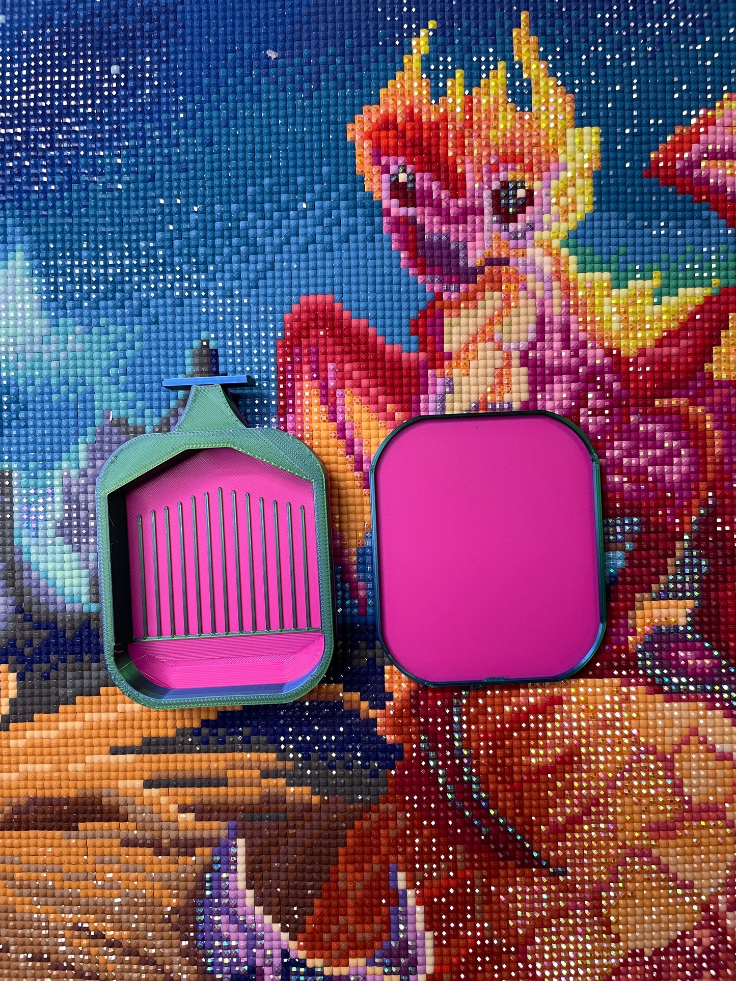 Deluxe 2 Phoenix small diamond painting tray in two colors on colorful dragon-themed background, mini-sized for art projects.