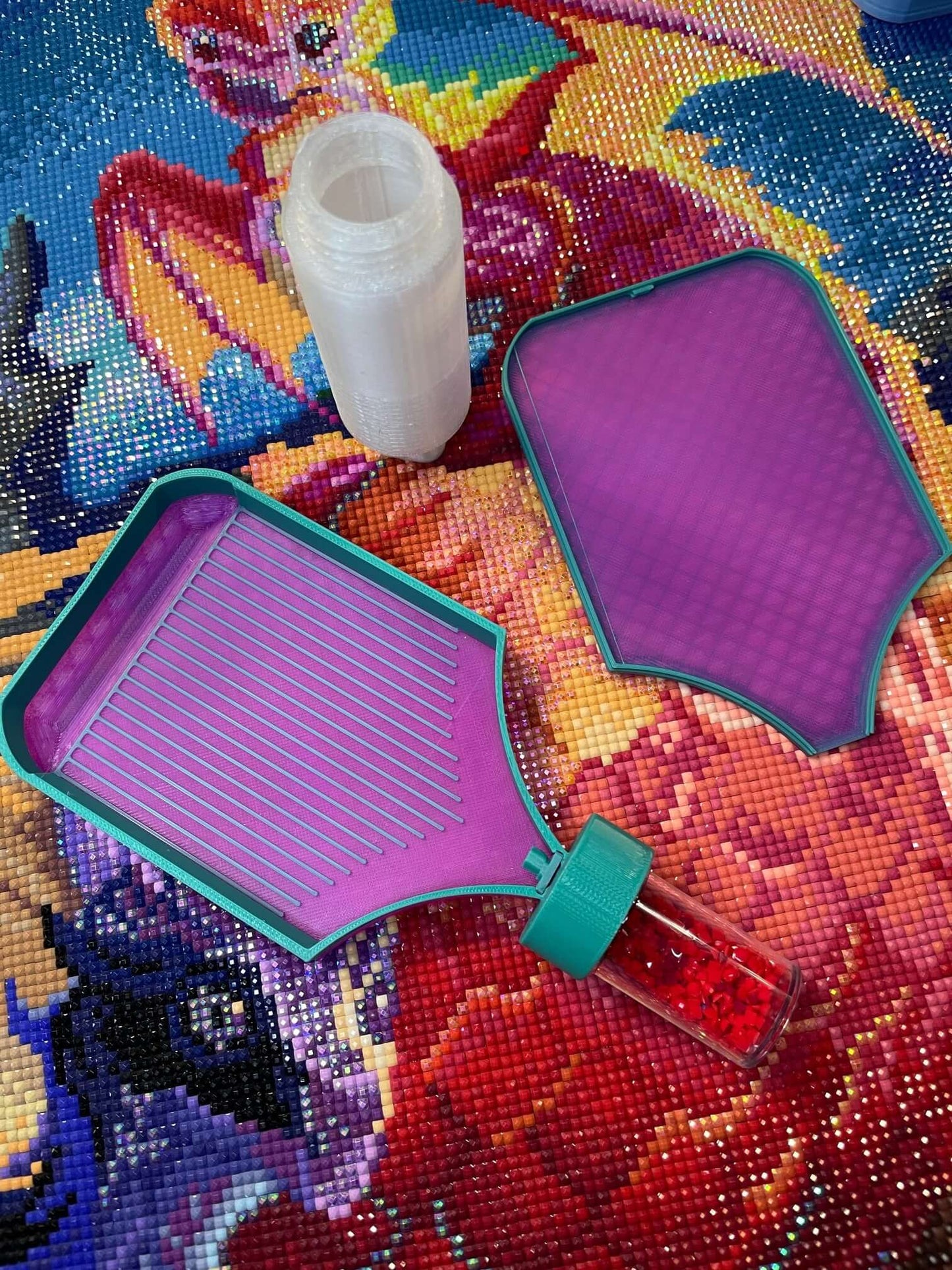 Dragonling Screw & Shake Diamond Art Tray with vibrant mat and container on colorful background.
