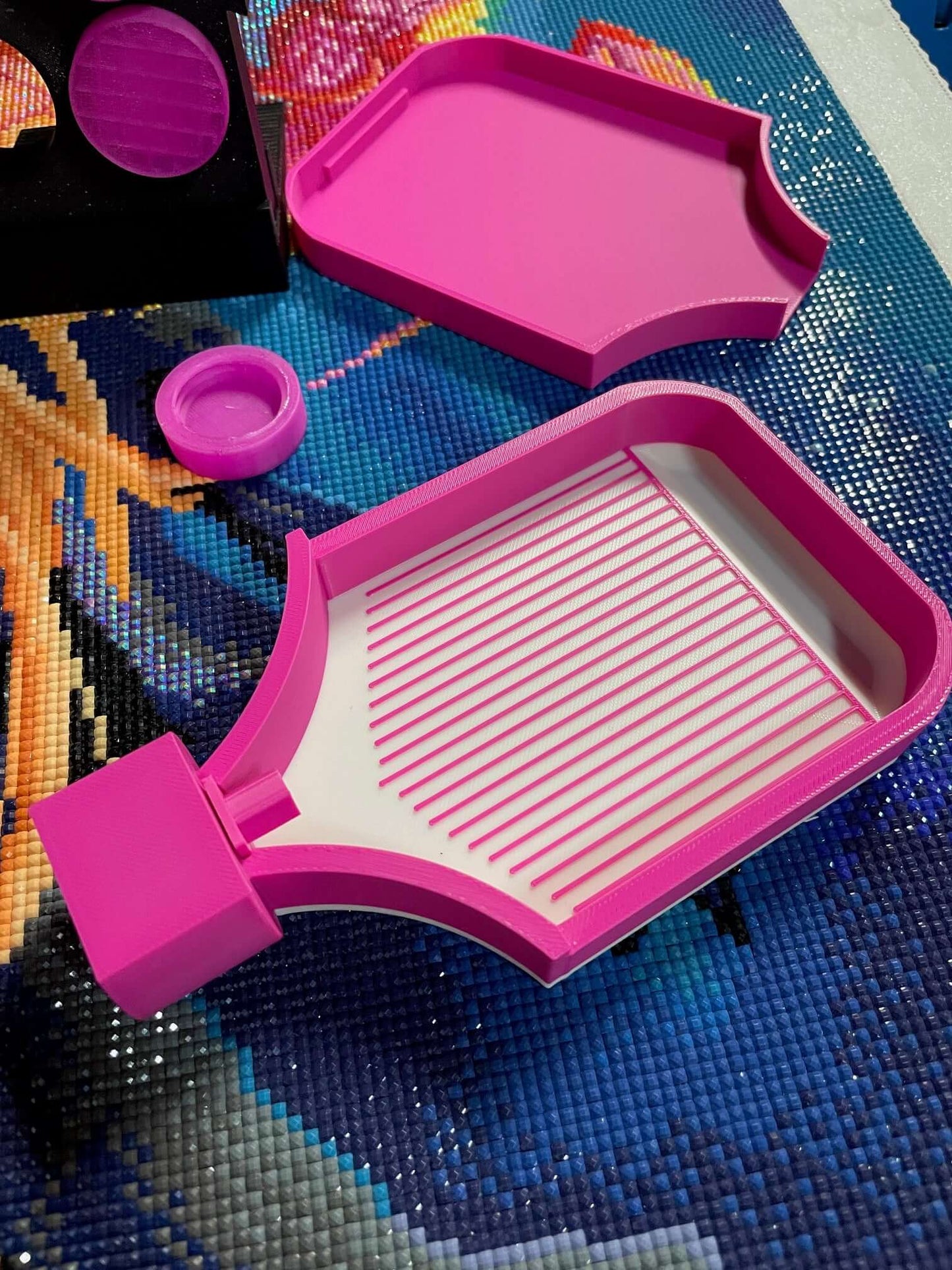Pink Screw & Shake Tray with screw-on lid and funnel, part of the Screw & Shake Starter Kit, displayed on a colorful background.