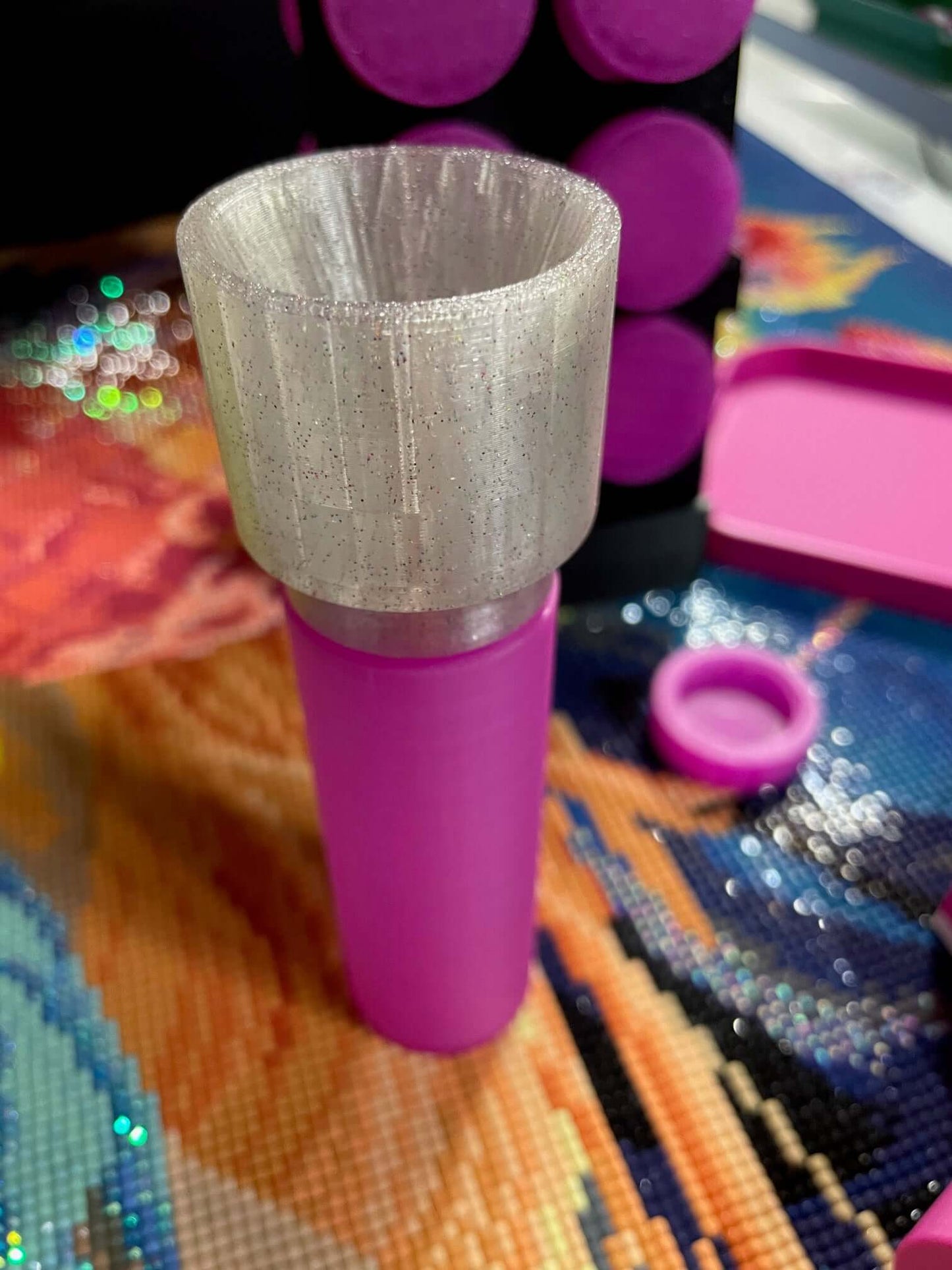 Pink container with a glittering screw-on funnel from the Screw & Shake Starter Kit on a colorful background.