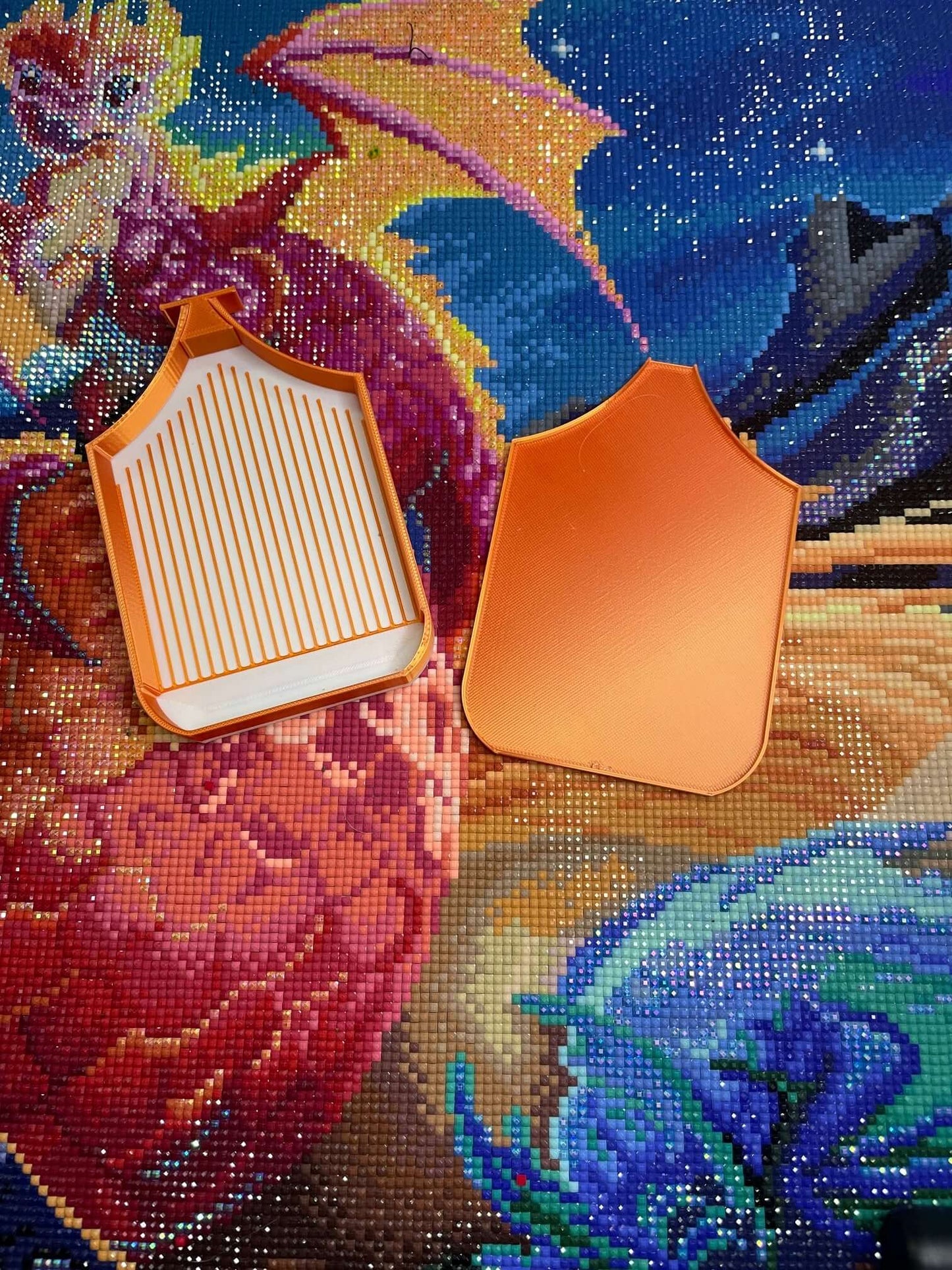 Orange dragonling art trays with white base on a vibrant dragon-themed background