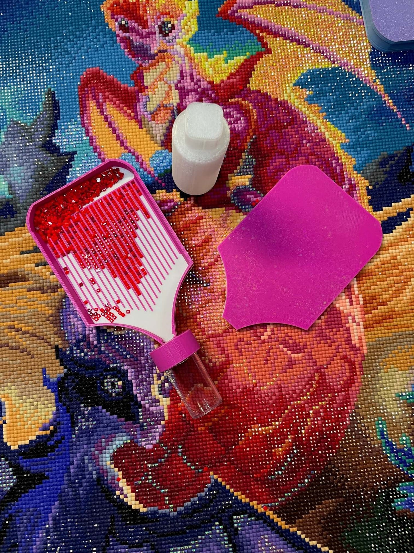 Dragonling Screw & Shake Diamond Art Tray with drill container on vibrant dragon-themed background