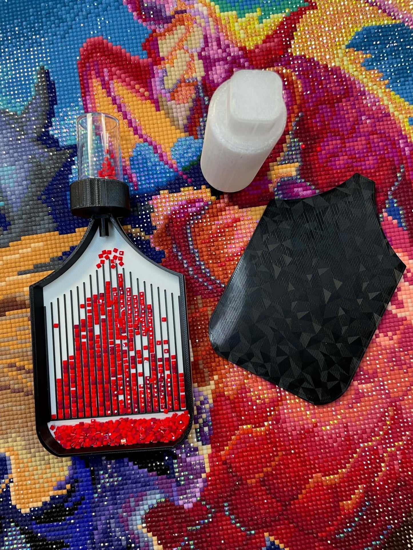 Dragonling Screw & Shake Diamond Art Tray with red drills and screw-in container option on colorful canvas background