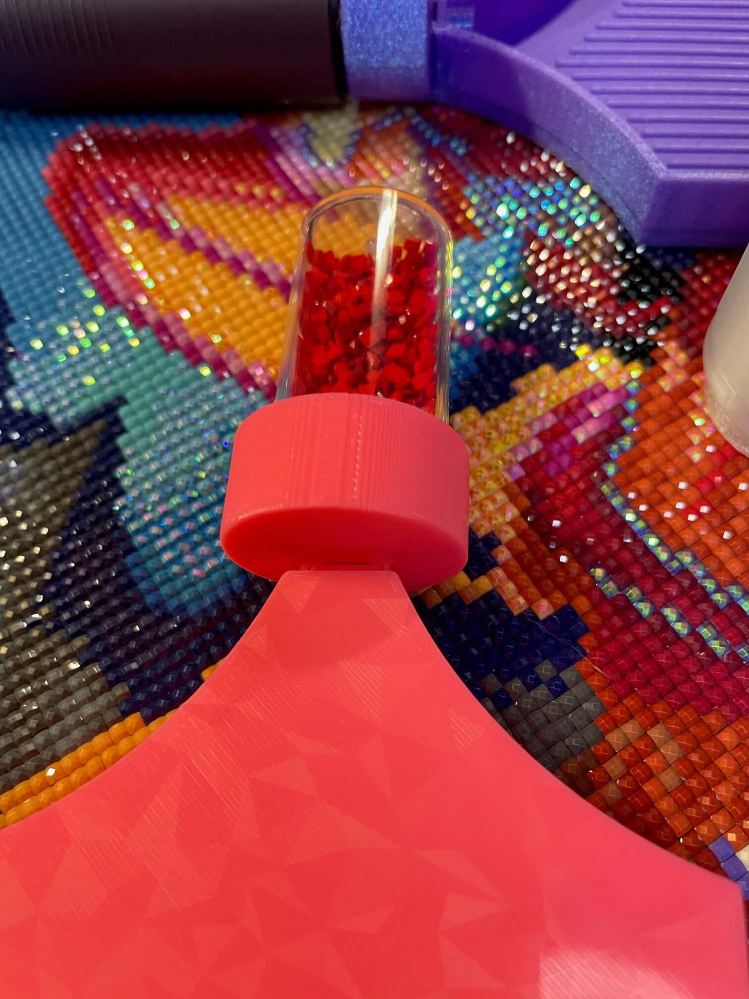 Dragonling Screw & Shake Diamond Art Tray with container attached on colorful background.