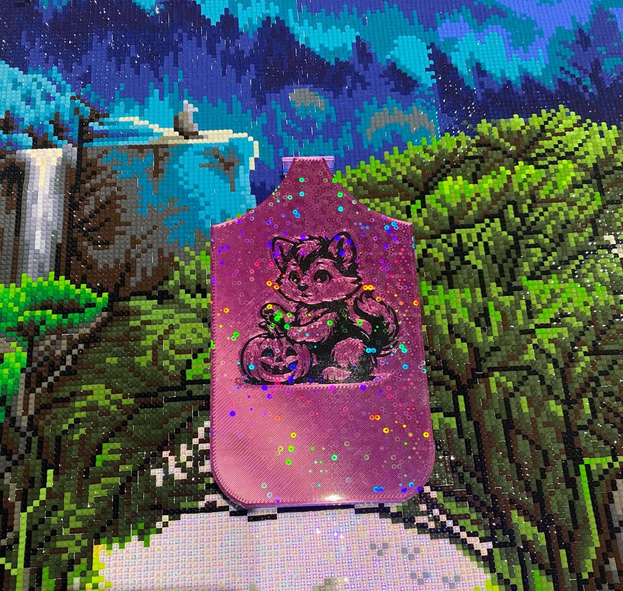 Pink Halloween dragon tray with werewolf pup and pumpkin design on a vibrant nature diamond art background.